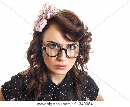 Unhappy Young Woman Looking Into The Camera With Serious Expression On Her Face. Isolated On White B