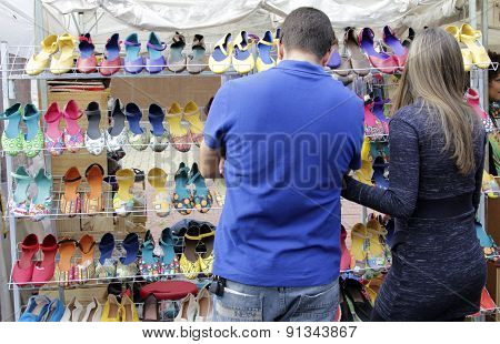 Couple Choose Products In A Street