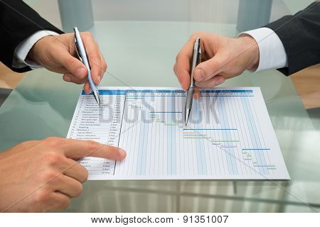 Two Businessmen Making Gantt Diagram
