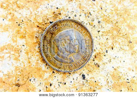 vintage coin depicting India's first Prime Minister Jawaharlal Nehru