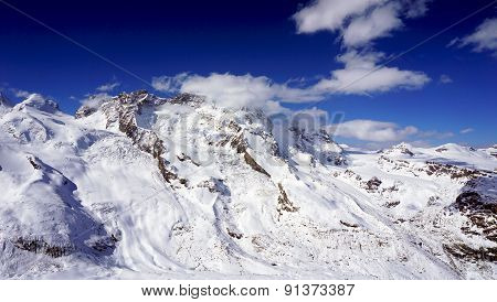 Snow Alps Mountains Scene And Blue Sky