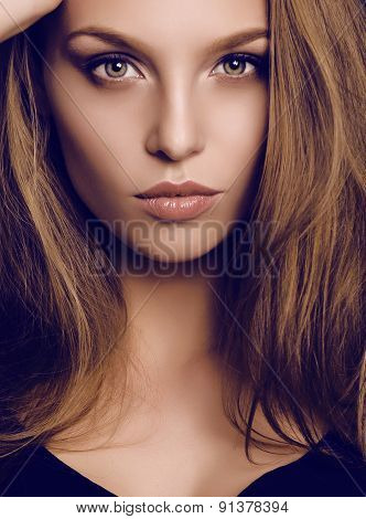 Potrait Of Beautiful Young Woman With Dark Hair And Green Eyes