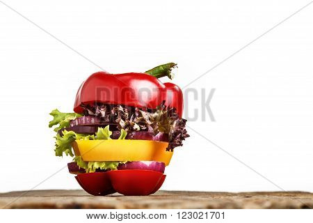 Healthy sandwich with fresh pepper, onion, salad lettuce on wooden background. Detox diet and healthy lifestyle.