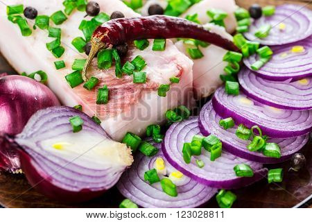 Fresh Pork Fat, With Red Hot Chili Peppers, Green And Purple Onions And  Peas Allspice Beautifully L