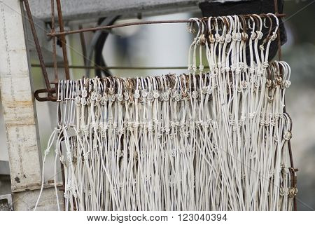 Fishing hooks drying on a blurred background