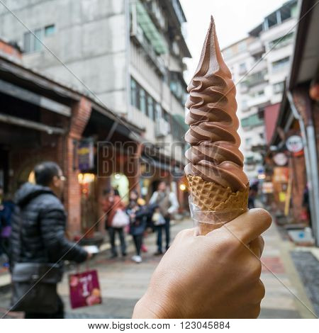 The delicious long Ice-cream cone (mixed strawberry and chocolate flavor) at food street market in Taipei, Taiwan.