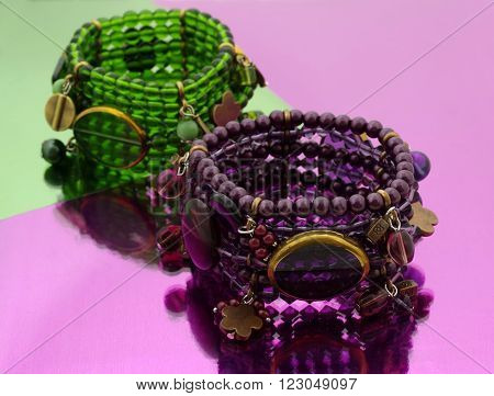 Oriental beads bracelet on ...... mirrorlike background