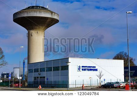 Kristianstad Sweden - March 20 2016: The water tower and the Kristianstads Vattenverk water supply building in early spring.