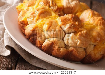 Freshly baked monkey bread with cheese macro on a plate. horizontal