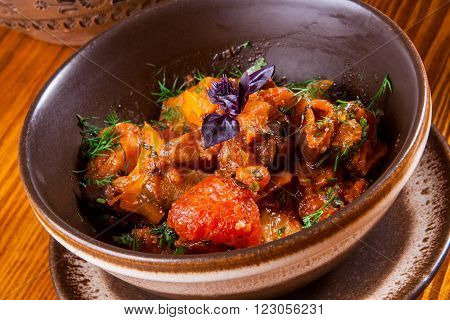 Caucasian cuisine. Ajapsandali with eggplant, pepper, tomato and herbs