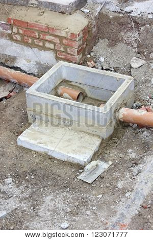 The construction of a new storm drain with two inlets being built