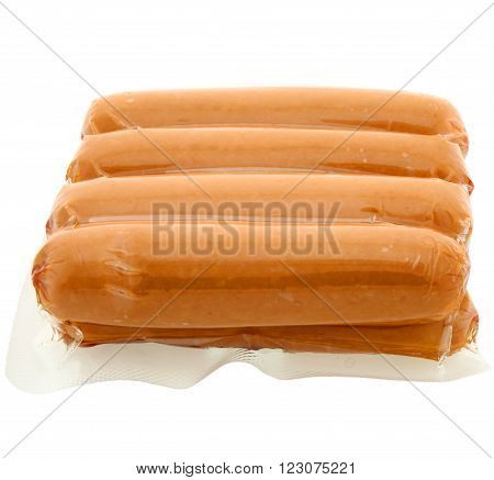 a pack of raw hot dogs on a white background