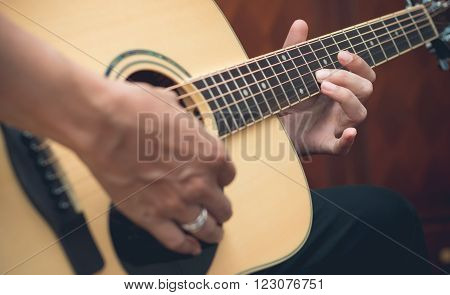 A Man Pro Musician Playing The Guitar Close-up
