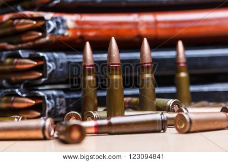 7.62 ammo for machine guns with loaded magazines on table