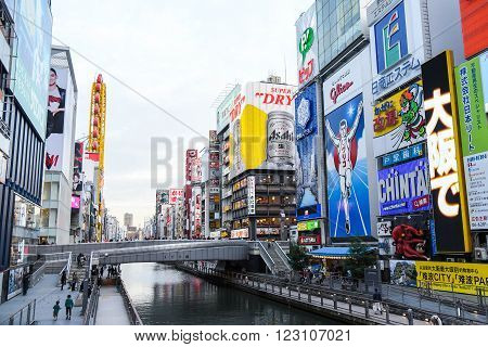 OSAKA JAPAN - NOVEMBER 20 2015 : The Glico Man light billboard and other brand logos in Dotonbori street Namba District one of famous tourist spots in Osaka Japan.