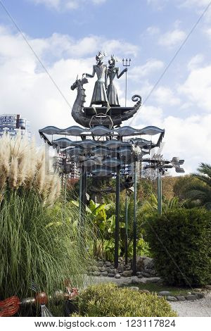SOCHI, RUSSIA - November 06, 2015: A sculpture the Tsar fish in green park Sochi against the multi-storey building and the blue sky. It is established in park 