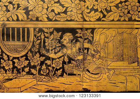 BANGKOK, THAILAND - FEB 14: Old golden fresco of Wat Pho temple with running warrior on February 14, 2015. Wat Pho is a biggest Buddhist temple complex founded in 16th century