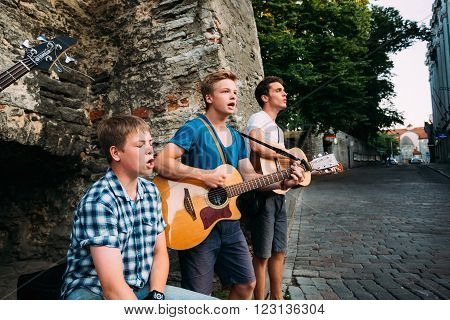 Tallinn, Estonia - July 25, 2014: Street Musicians Buskers Play Evening Near Famous Viru Gate In Old Part Of City Tallinn. Viru Gates were built in the 14thC, still standing today.