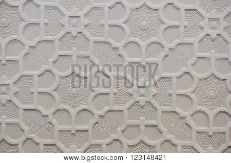 white Islamic pattern with stars on white wall