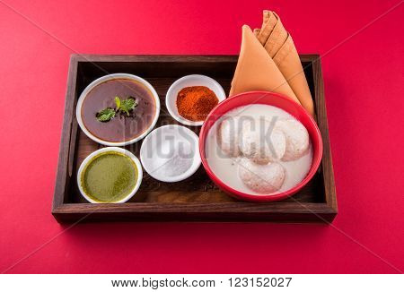 dahi vada or dahi vade also known as Curd Vadai in South India, a popular snack famous all over India prepared by soaking lentil vadas in thick dahi or yogurt, topped with spicy & sweet chutney etc