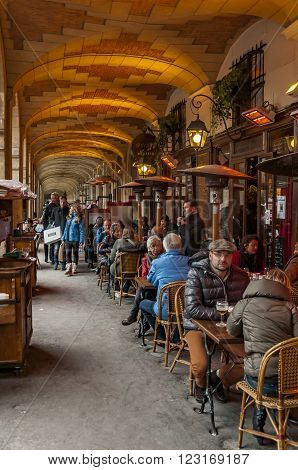 PARIS - MARCH 2: typical Paris cafe with people that enjoy dinner on March 2 2014 in Paris France