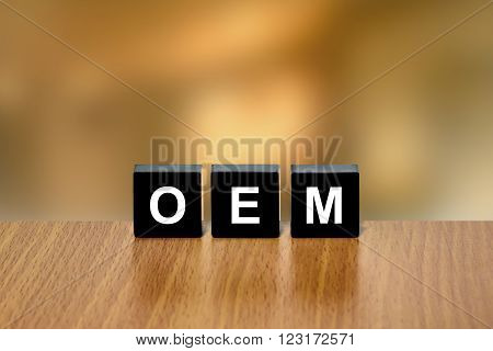 OEM or Original Equipment Manufacturer on black block with blurred background