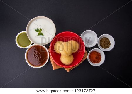 dahi vada or dahi vade also known as Curd Vadai in South India, a popular snack famous all over India prepared by soaking lentil vadas in thick dahi or yogurt, topped with spicy & sweet chutney etc