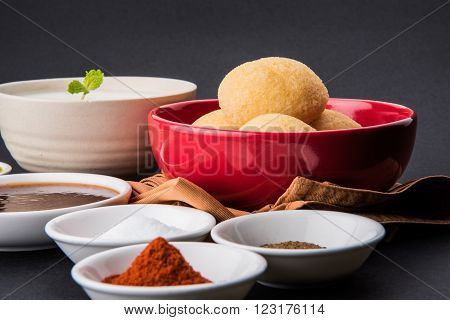 dahi vada or dahi vade also known as Curd Vadai in South India, a popular snack famous all over India prepared by soaking lentil vadas in thick dahi or yogurt, topped with spicy & sweet chutney etc