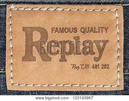 CHISINAU MOLDOVA - March 08 2015: Close up of the Replays leather label on the blue jeans. Replay - Italian brand one of the leaders in the world of men's and women's denim clothing.