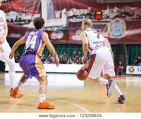 SAMARA RUSSIA - NOVEMBER 06, 2013: BC Krasnye Krylia guard Anton Ponkrashov (7) with ball is on the attack during the BC Royal Hali Gaziantep game on November 06 2013 in Samara Russia.