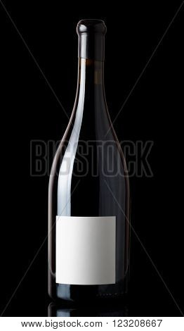 Shiraz red wine in Burgundy style bottle, isolated on black