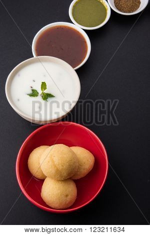 dahi vada or dahi vade also known as Curd Vadai in South India, a popular snack famous all over India prepared by soaking lentil vadas in thick dahi or yogurt, topped with spicy & sweet chutney etc