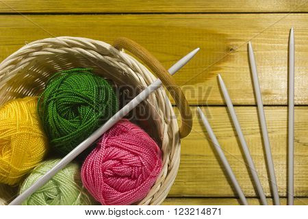 The inverted pad with the different colored threads and spokes for knitting