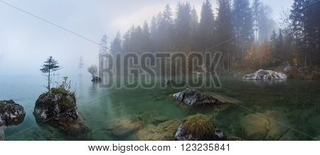 Misty summer morning on the Hintersee lake in Austrian Alps.