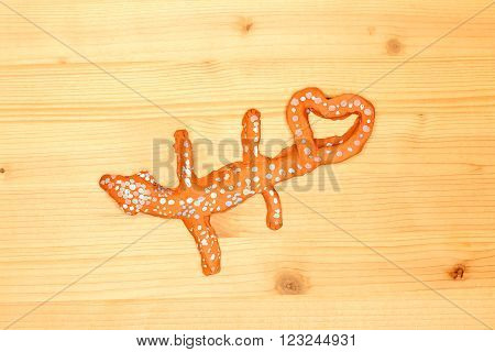 handmade clay lizard with a heart symbol