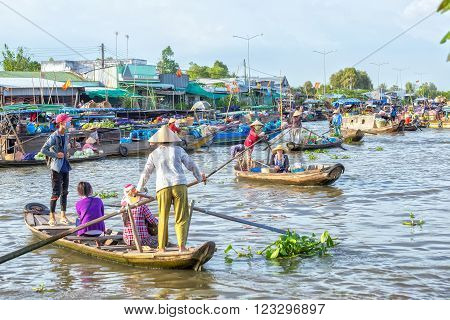 Soc Trang, Vietnam - February 2nd, 2016: Ferry women take visitors sailing across the river and down, crowded on the river to reach the festival days in rural areas of Soc Trang, Vietnam