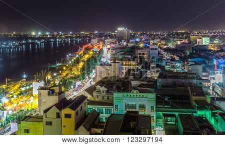 Can Tho, Vietnam - February 3rd, 2016: One corner Can Tho city in the night peace with houses along the river shining ornamental lights more beautiful and simple guide to make one miss away from home Can Tho, Vietnam