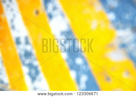 Blurred yellow lines on concrete floor/road/street, close up.
