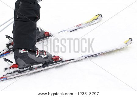 a foot closeup skier, winter sports background