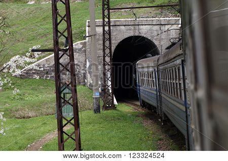 Transportation railway train enters the tunnel, the view from the car of a train