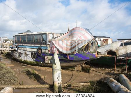 Shoreham-on-Sea, UK - February 6 2016 : Old barge converted into a house boat with part of a bus in the design.