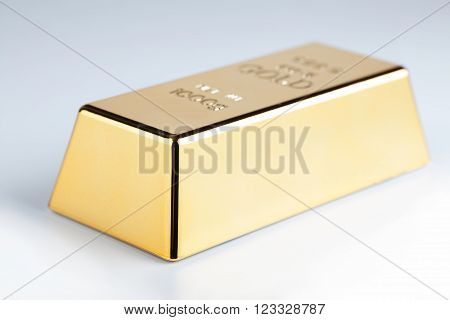 closeup of gold bullion on a light background