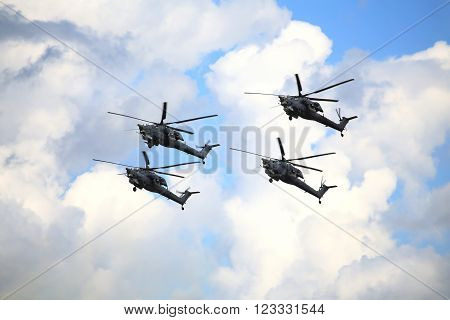 RYAZAN REGION  - AUGUST 2: Four modern russian attack helicopters Mi 28 at a low altitude   -  on August 2, 2015 in Ryazan region