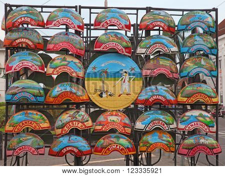 YOGYAKARTA - AUGUST 03: Wheel decorations for traditional rikshaw in Yogyakarta, Java, Indonesia on August 03, 2010. Bicycle rikshaw remains popular means of transport in many Indonesian cities.