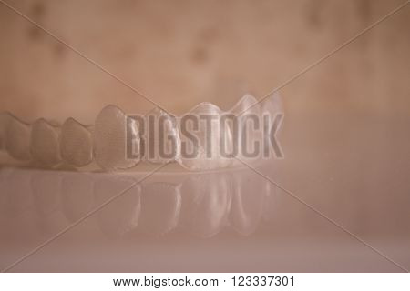 Invisible orthodontics reflected on the surface. No people.