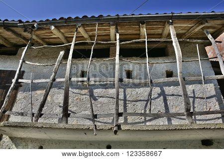 Old derelict buildings in the village of Somp Cornino in Friuli Venezia Giulia Italy. These historic farmhouse buildings date back to the eighteenth century.