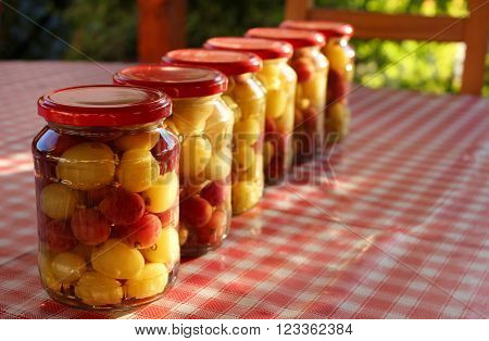 Bottled white and red grape in the table