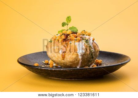 Rajasthani Shahi Raj Kachori, stuffed katchori with potato and sprout filling and served with curd, chutney and sev