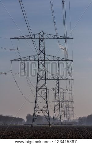 Flevoland the Netherlands - March 26 2016: High tension pwer masts.