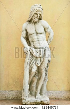 Statue of Hercules against Yellow Wall Background in Varna Bulgaria